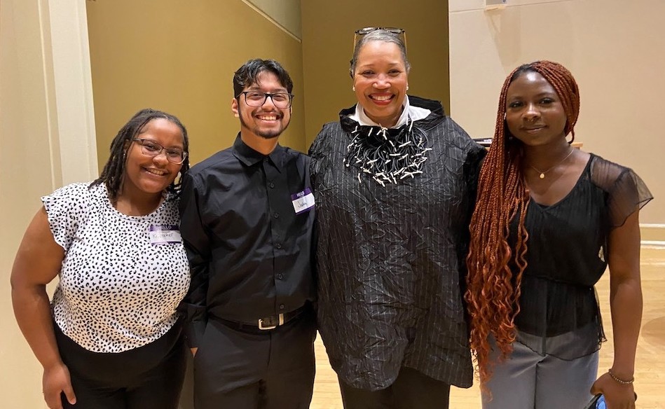 SHSU interior design students Kristopher Jones, Joshua Gaona and Rebecca Oseni pose with keynote speaker and IIDA CEO, Cheryl Durst (second from right).